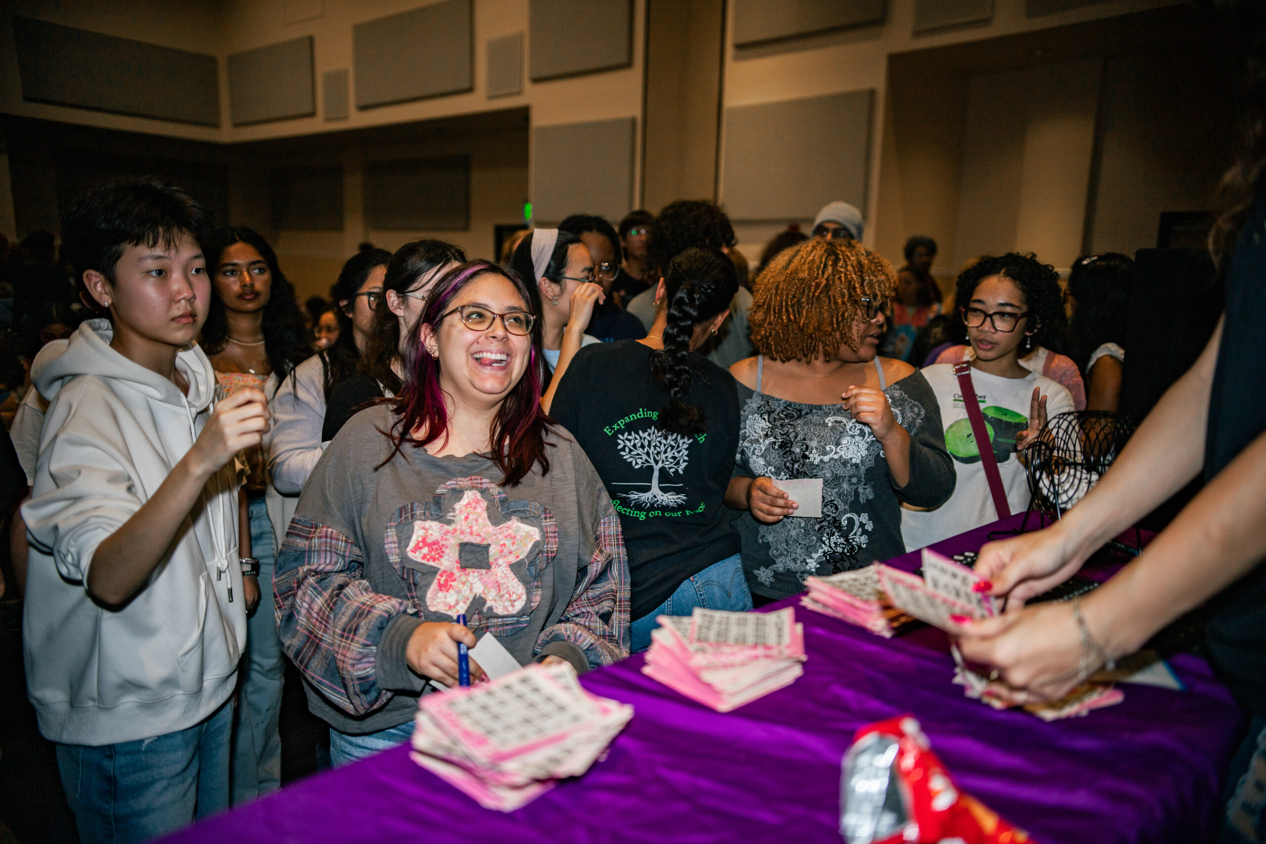 Students in line to get bingo sheets from vender in Pegasus ballroom