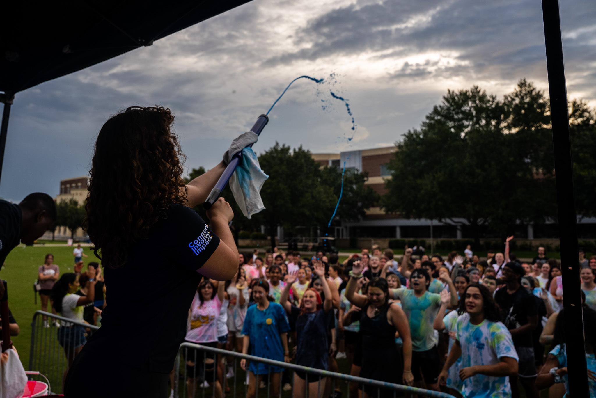 Paint Rave Event Student Spraying Paint at Stage